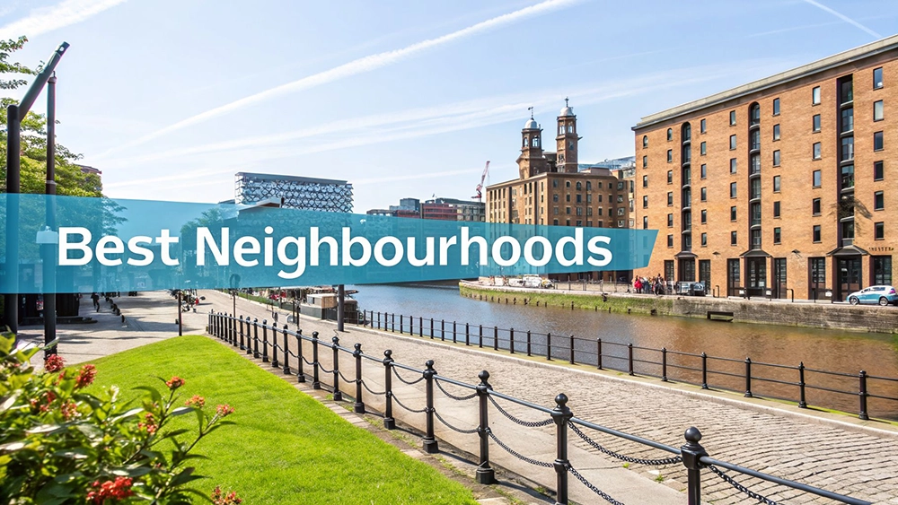 Sunny view of a city canal with historic and modern buildings, a path, and green spaces.